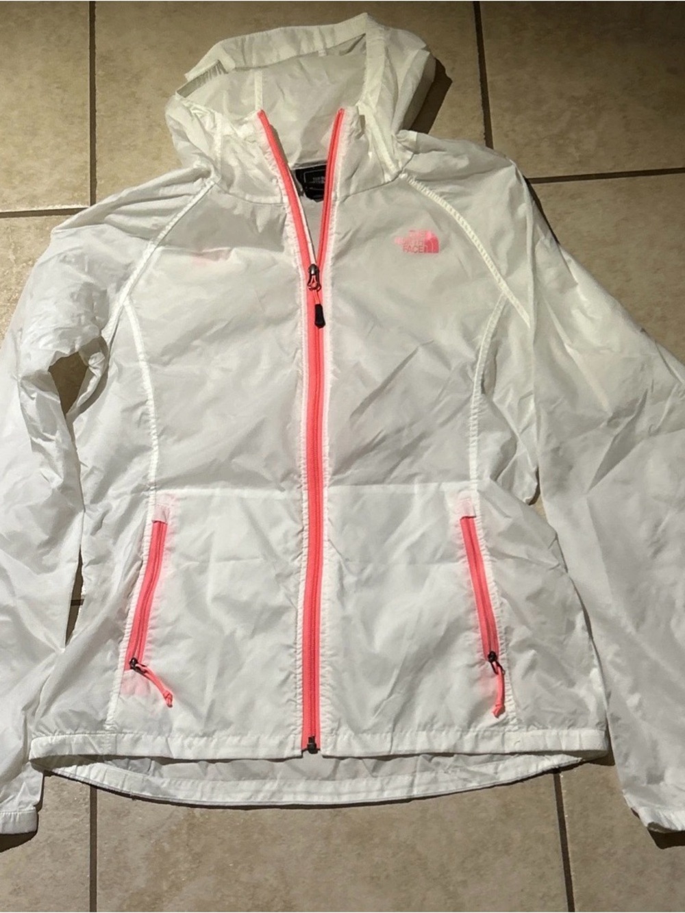 The North Face women’s white windbreaker with pink trim Size M